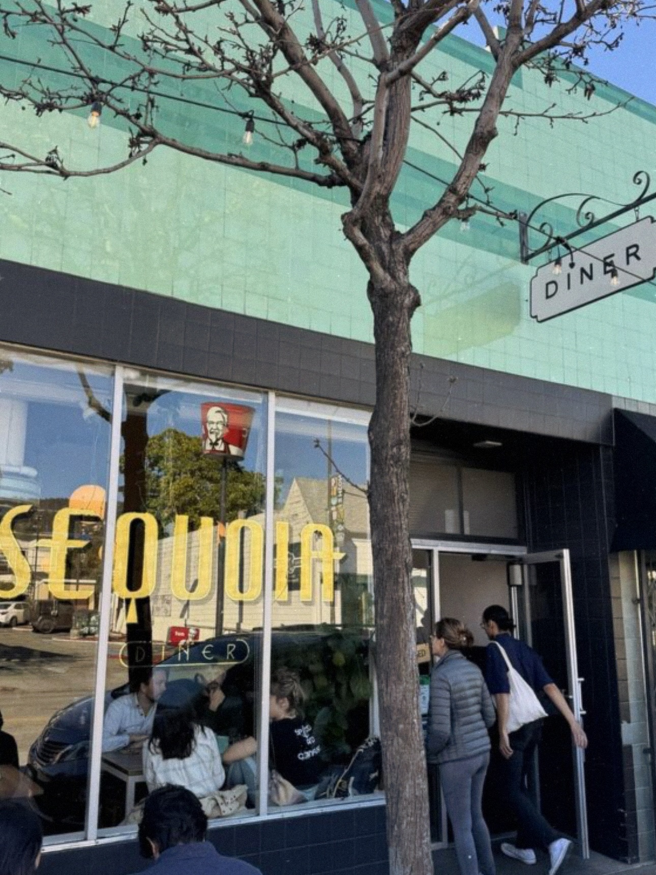 The Sequoia Diner storefront exterior with the illuminated window sign and hanging diner sign